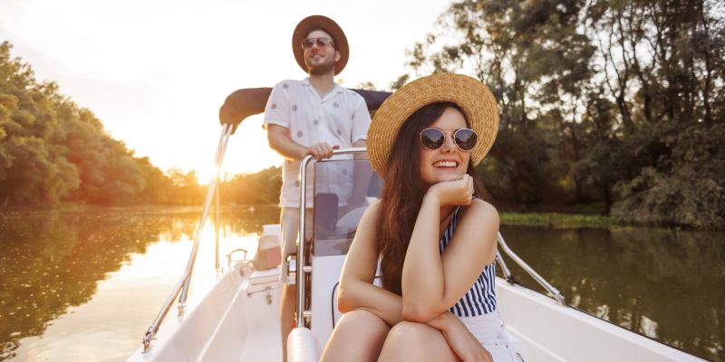 young couple on a evening boat ride with peace of mind having insurance